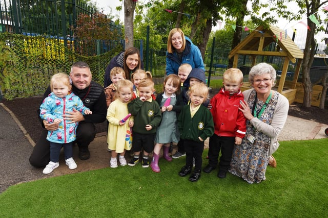 Staff and excited school pupils enjoy their new play area thanks to a successful fund-raising campaign.
