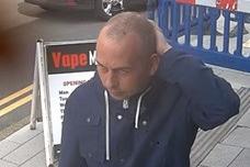 One of the men wanted by police, described as "person A"
