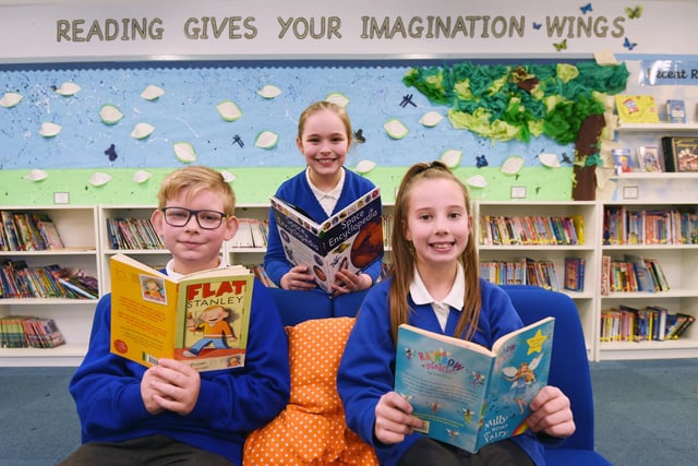 Children enjoy their new library, which was funded by a sponsored readathon.