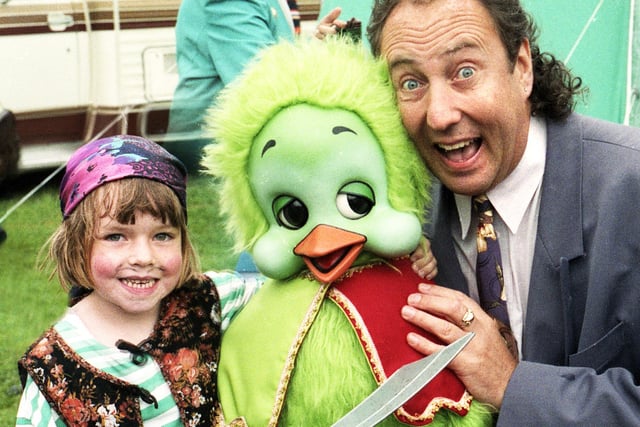Television's Keith Harris and Orville are confronted by pirate Zoe Spellman and her cutlass at Standish Carnival on Saturday 7th of August 1993.