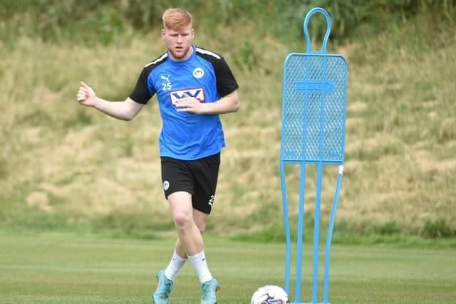 Wigan Athletic youngster Josh Stones has joined Oldham on a 28-day youth loan