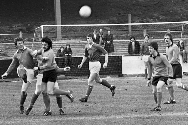 Wigan Athletic full back, Kenny Morris, clears the danger from Macclesfield Town during a Northern Premier League match at Springfield Park on Monday 11th of April 1977.
The game was a 0-0 draw.