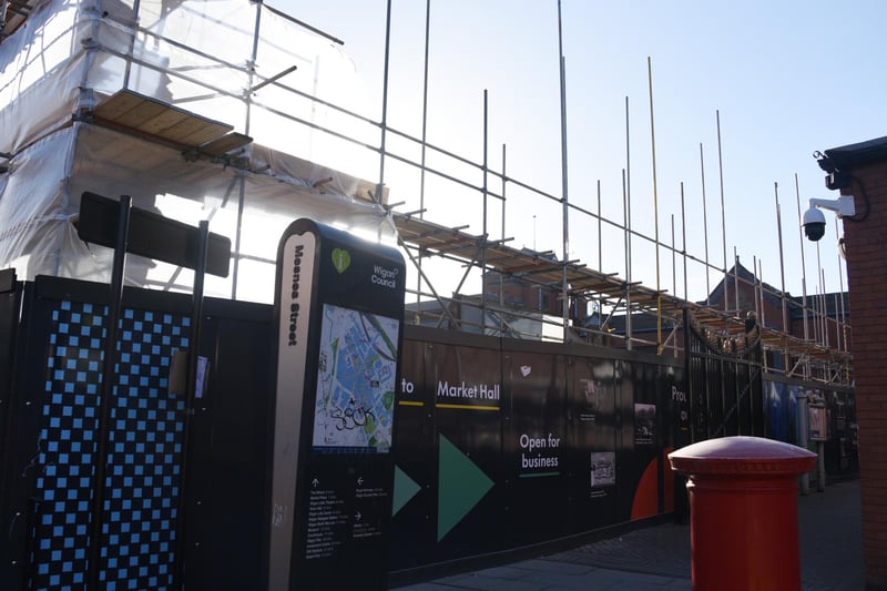Hoardings direct shoppers to still open Wigan town centre outlets while The Galleries demolition continues
