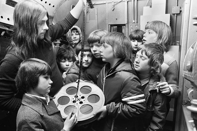 Wigan ABC Minors are shown the workings of the projector room at the Ritz cinema by projectionest Tom Bridge on Saturday 16th of February 1974.