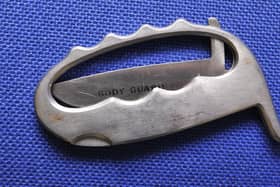 Ian Carrington is accused of possessing several weapons, including a knuckleduster like this one