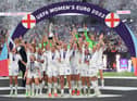 Leah Williamson of England lifts the UEFA Women's EURO 2022 Trophy after their sides victory during the UEFA Women's Euro 2022 final match between England and Germany at Wembley Stadium on July 31, 2022 in London, England. (Photo by Shaun Botterill/Getty Images)
