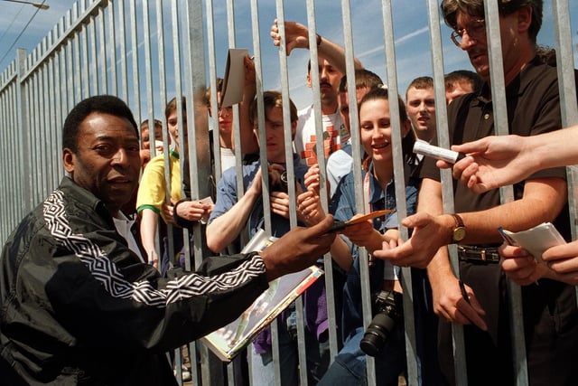 Pele signs autographs for fans at the JJB headquarters at Martland Mill in 1996
