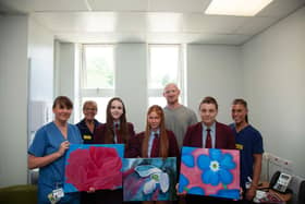 Liam Farrell with Wigan Infirmary staff and Shevington High School pupils