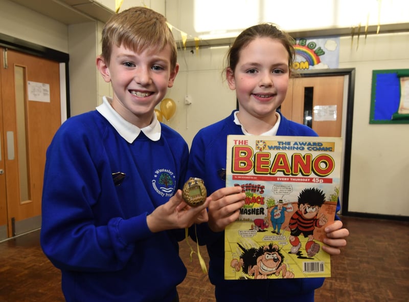Members of the school council with some of the items from the time capsule, with a cassette tape of The Spice Girls, Tamagotchi (handheld digital pet popular in 1997), school work, letters and newspapers from the day.