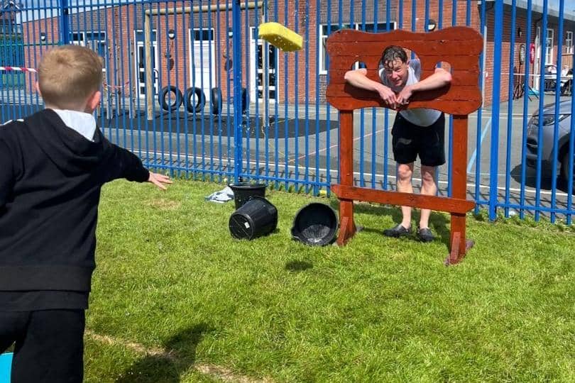 Headteacher Ross Aldridge proved a good sport as pupils took aim in 'Soak the headteacher'