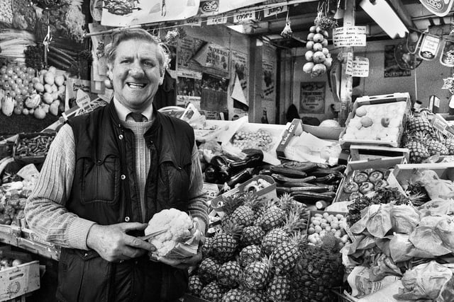Ken Hall on his fruit and vegetable stall in the old Wigan market hall in December 1987 just prior to closure of the building.