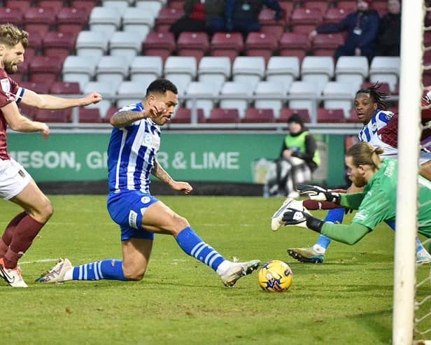 Josh Magennis levels the scores from close range