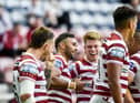 Bevan French celebrates with his teammates after scoring his seventh try