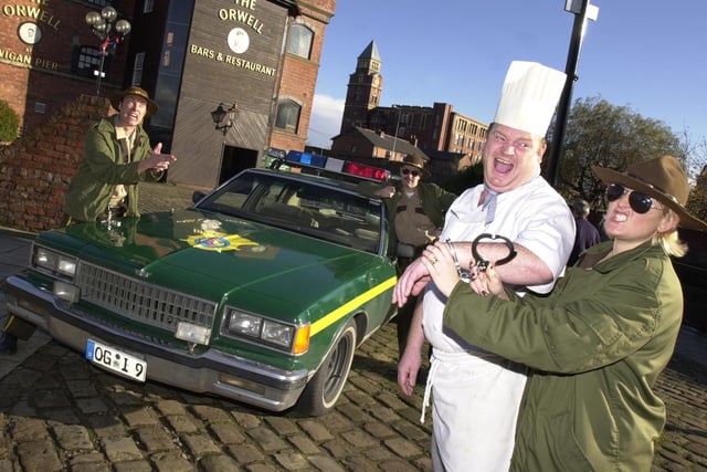 Sean Drummond, head chef at The Orwell, is apprehended by Officers Fitzroy, Hoollerhan and Mahoney as the Super Troopers drop in at Wigan Pier to promote their film.