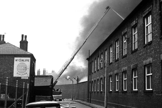 RETRO 1967   Firefighters tackle the blaze at Taylor's Carpets in Victoria Mills off Miry Lane Wigan.