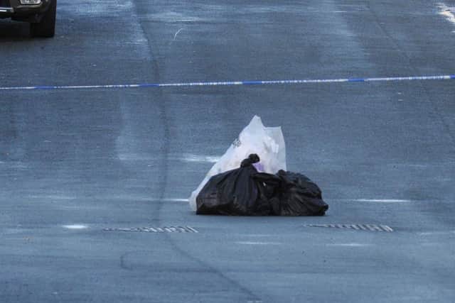 Items were placed in the road inside the police cordon on Kilburn Drive, Shevington