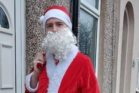 Jordan Gaskell has been dressing as Father Christmas to hand out presents