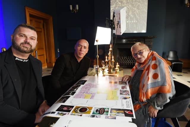 Mary Major looks over the plans for Haigh Hall with creative directors Al and Al