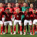 James Carragher (back row, third from right) lines up for his Malta debut against Finland
