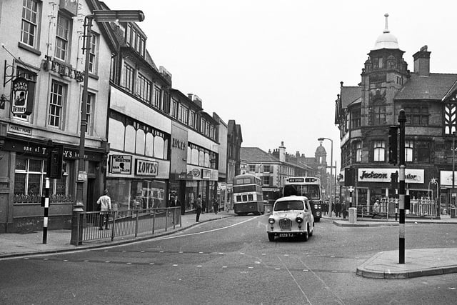 A view of Market Place looking down Market Street in 1971 with the Black Horse pub, Nora Webster's Hair Salon and Lowes store on the left with Jackson the Tailor and Sarah Lynnn's confectioners on the right.