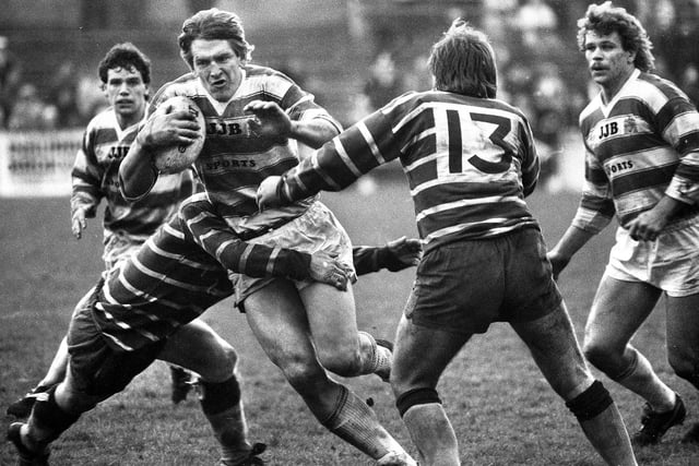 Wigan forward Graeme West on a powerful charge against Featherstone Rovers with Mike Ford and Nick Du Toit backing up in a league match at Central Park on Sunday 21st of April 1985. Wigan won the match 12-10.