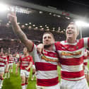 Wigan will face Hull FC in a pre-season match next year in the testimonial match for former player Scott Taylor, pictured above celebrating the 2013 Grand Final victory alongside Michael McIlorum