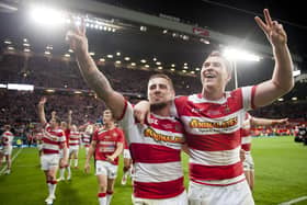 Wigan will face Hull FC in a pre-season match next year in the testimonial match for former player Scott Taylor, pictured above celebrating the 2013 Grand Final victory alongside Michael McIlorum