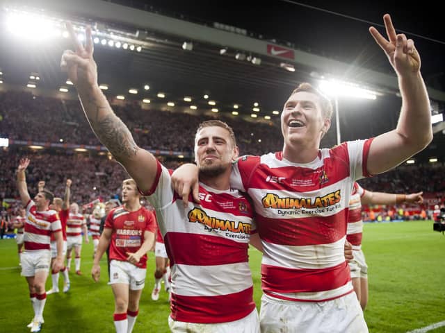 Wigan will face Hull FC in a pre-season match next year in the testimonial match for former player Scott Taylor, pictured above celebrating the 2013 Grand Final victory alongside Michael McIlorum