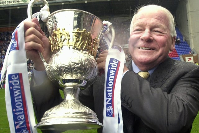 Dave Whelan gets his hands on the cup as Wigan Athletic lift the Division 2 championship trophy after beating Barnsley 1-0 with a Tony Dinning goal  on Saturday 3rd of May, the last day of the 2002/2003 season. 