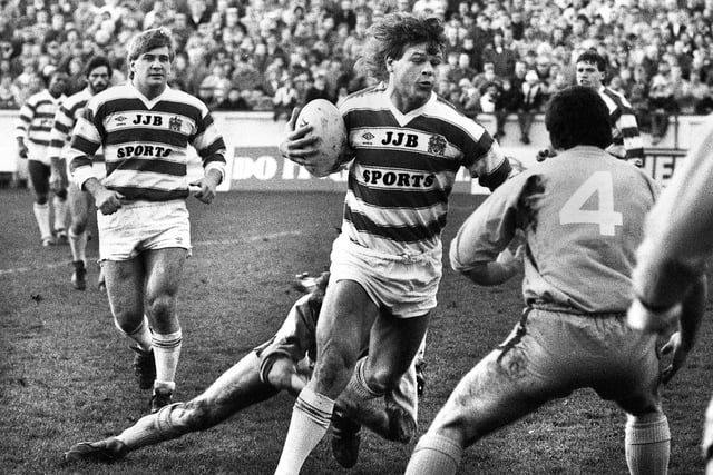 Wigan forward Nick Du Toit in action against St. Helens backed up by Shaun Wane in a league match at Central Park on Boxing Day Thursday 26th of December 1985. Wigan won the match 38-14.