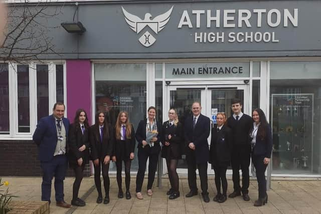 Atherton High School pupils with headteacher Ben Layzell, Education Secretary Gillian Keegan and Leigh MP James Grundy