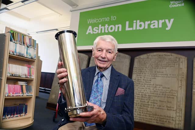 Founder of the community group FAB, Don Hodgkinson, with the time capsule.
