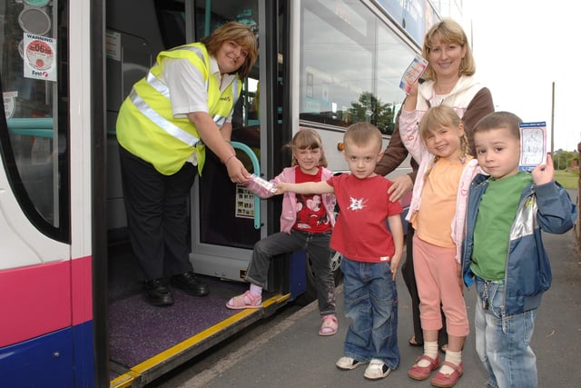 2008 TICKETS PLEASE!..Kendal, Logan, Sophie, Lewis and nursey teacher Patricia Lambert from Shevington CP School and Milestones Daycare about to board a First Manchester double decker bus, brought along by bus driver Jenny Bissell, whose son attends the school, and her colleague Gail Unsworth, as part of their topic on transport. 