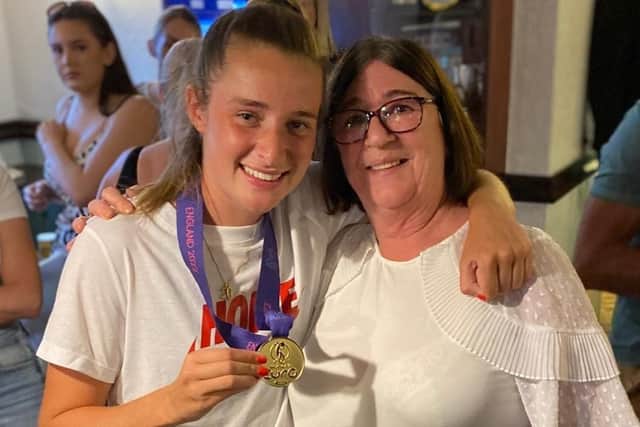 Ella Toone shows off her medal in the Union Arms