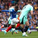 Christian Saydee in action for Portsmouth against Latics at Fratton Park in April, 2024