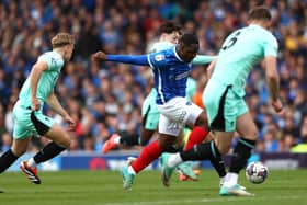 Christian Saydee in action for Portsmouth against Latics at Fratton Park in April, 2024