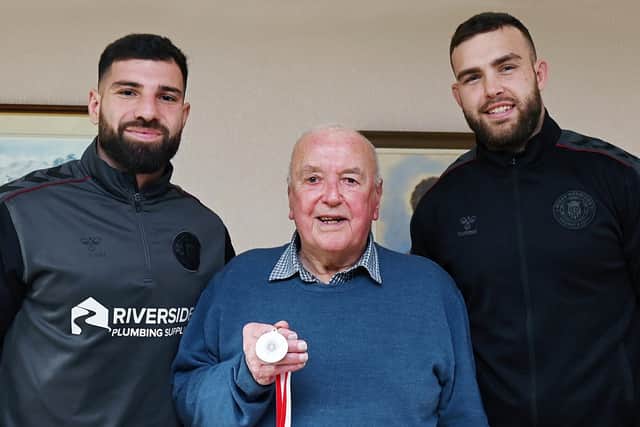 Wigan Warriors players Abbas Miski and Kaide Ellis meet life-long fan Eric Bramhall