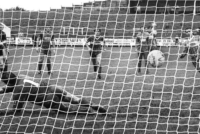 Wigan Athletic striker Warren Aspinall scores from the penalty spot in the Division 3 match against Bournemouth at Springfield Park on Saturday 21st of September 1985. Latics won the match 3-0 with Aspinall scoring two penalties and Mike Newell the other goal.