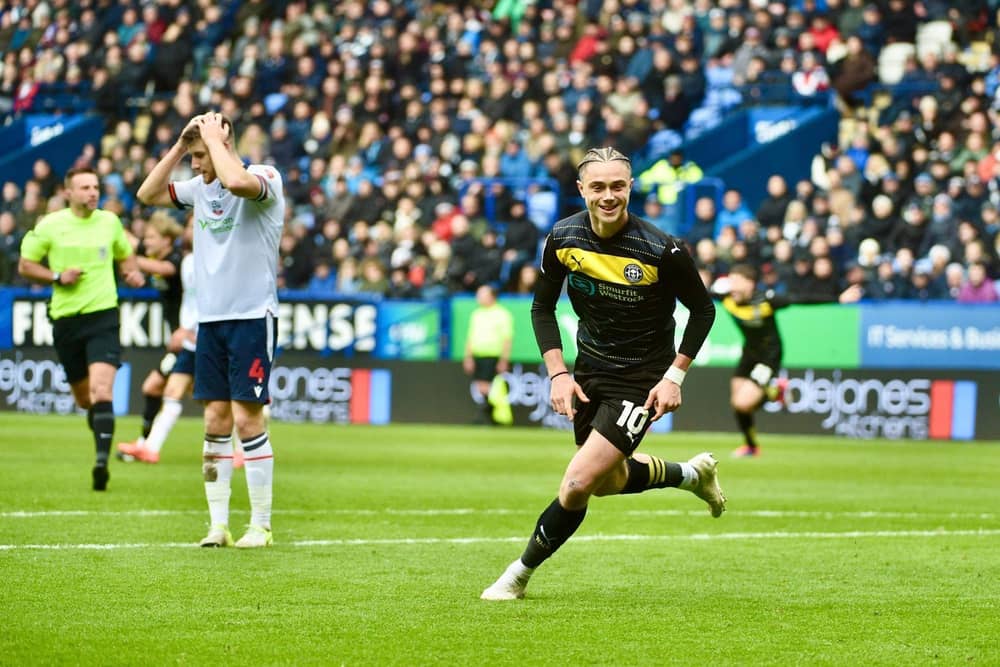 Thelo Aasgaard wheels away in delight after scoring Latics' second goal