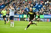 Thelo Aasgaard wheels away in delight after scoring Latics' second goal