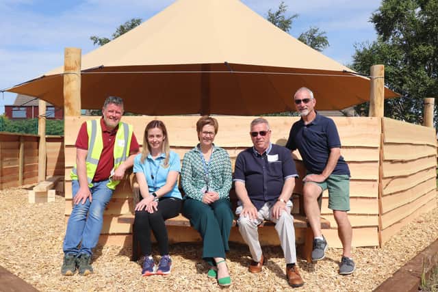 Staff at St Marie's enjoying the new bench