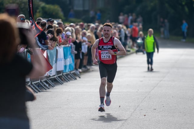 The 10th annual Wigan 10k, Mesnes Park Wigan. Pictured; Race Winner Jake Sache Crosses the finnishing line with a time of 33 Minutes 33 Sec.