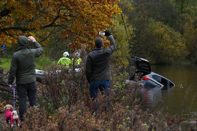 A crowd gathered and many filmed the action on their phone.