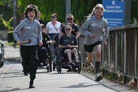 Woodfield Primary pupils run with the baton to pass on to Beech Hill Primary School pupils on Spencer Road, Wigan.  Action from the Wigan stages of Relay Your Way, a national relay event covering a distance of 2500km in 33 Days.