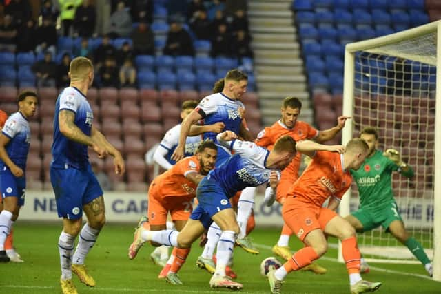 Charlie Wyke makes his presence felt in the box against Blackpool