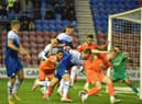 Charlie Wyke makes his presence felt in the box against Blackpool