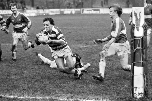 Wigan scrum-half Gary Stephens dives over for a try against Wakefield Trinty in a league match at Central Park on Sunday 15th of November 1981.
Wigan won 16-5.
