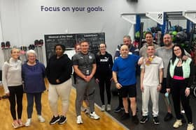 Group participants and Personal Trainers at gym