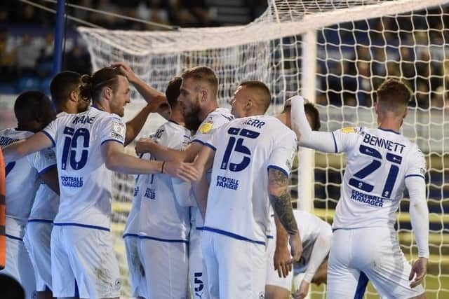 The Latics players celebrate at Portsmouth before it all went wrong