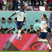 I'LL SECOND THAT: England's Bukayo Saka celebrates scoring the second goal against Group B rivals Iran with Declan Rice (right) at the Khalifa International Stadium. Picture: Nick Potts/PA